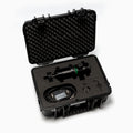 Black protective case with foam interior containing electronic components on a white background