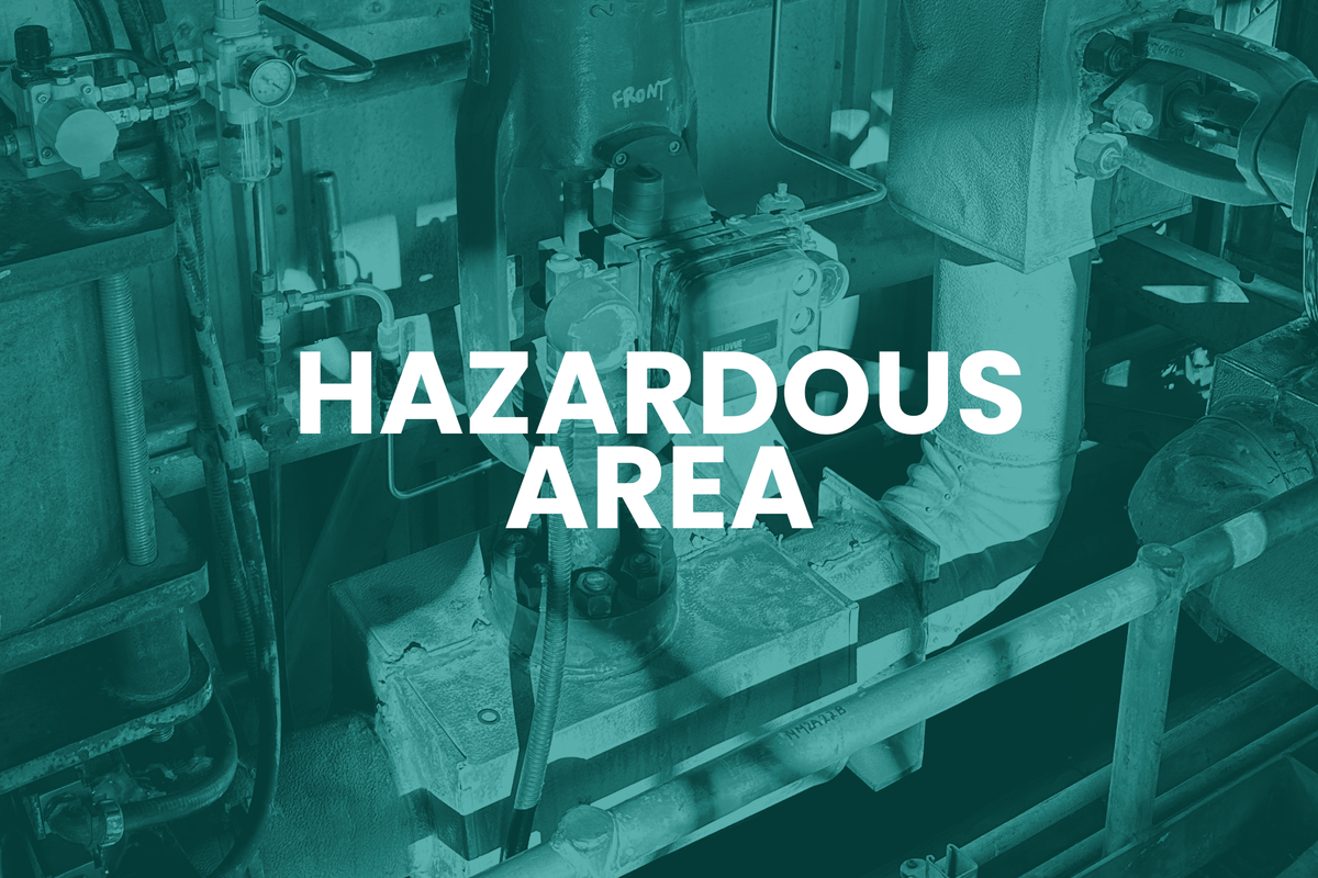 Industrial machinery with 'Hazardous Area' text overlay