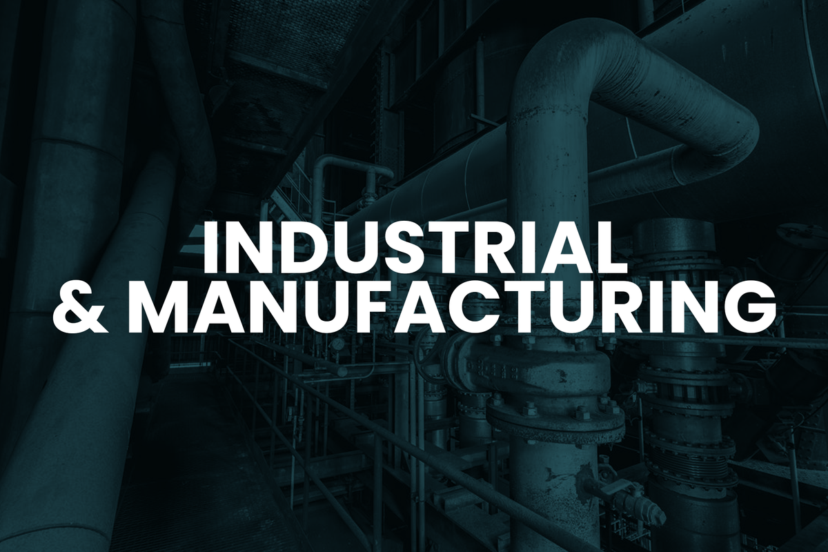 Industrial setting with pipes and machinery, featuring text 'INDUSTRIAL & MANUFACTURING'.